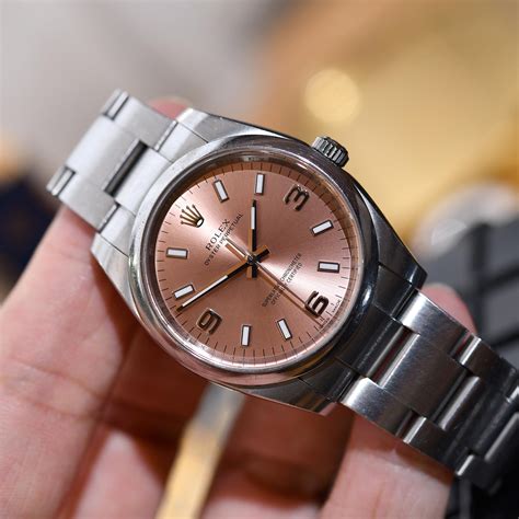 rolex oyster steel pink dial.